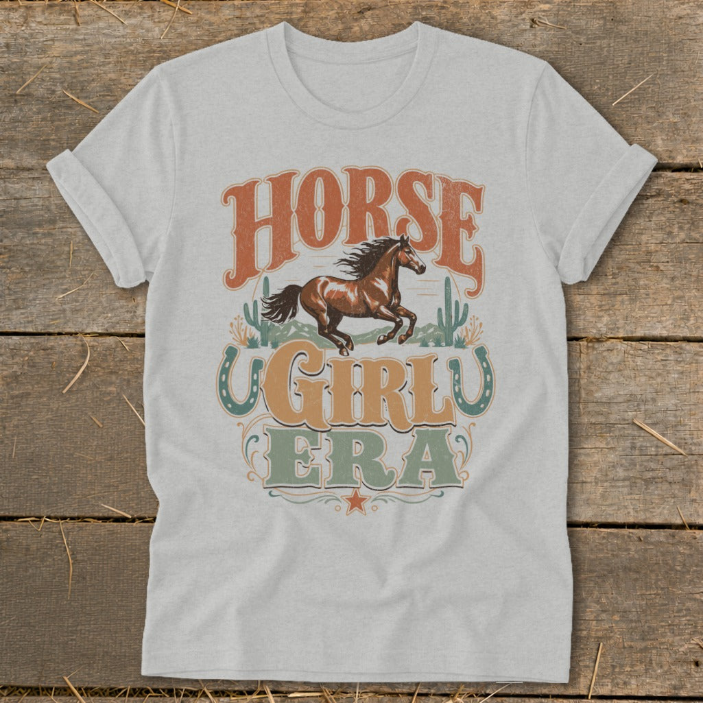 Light heather gray t-shirt with "Horse Girl Era" text and running horse graphic.