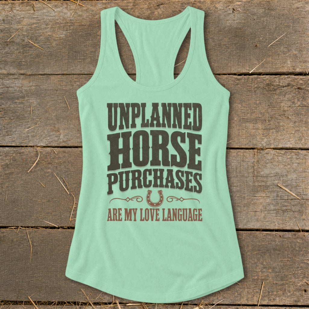 Mint green tank top with "UNPLANNED HORSE PURCHASES ARE MY LOVE LANGUAGE" text and horseshoe graphic.