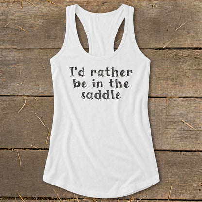 White tank top with black text "I'd rather be in the saddle".