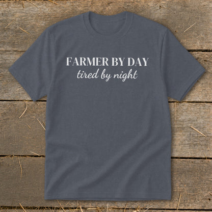Dark grey t-shirt with white text "FARMER BY DAY tired by night".