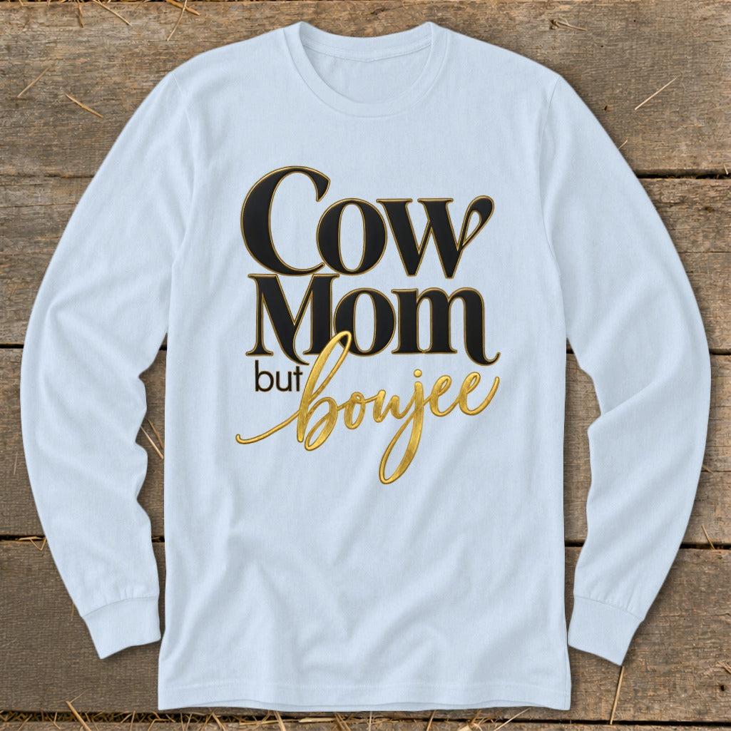 Long sleeve t-shirt with text "Cow Mom but boujee" in black and gold.