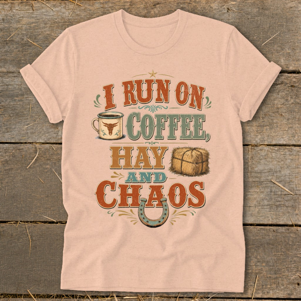Light pink t-shirt with "I run on coffee, hay, and chaos" graphic.
