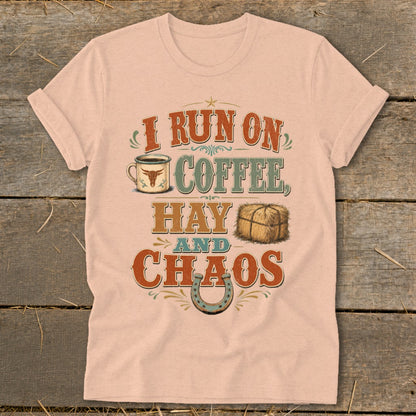 Light pink t-shirt with "I run on coffee, hay, and chaos" graphic.