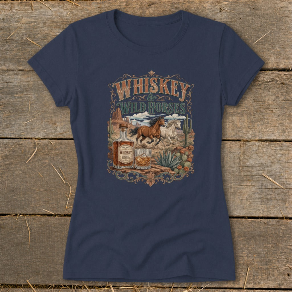 Navy t-shirt with "Whiskey & Wild Horses" graphic featuring horses, whiskey bottle, and desert landscape.