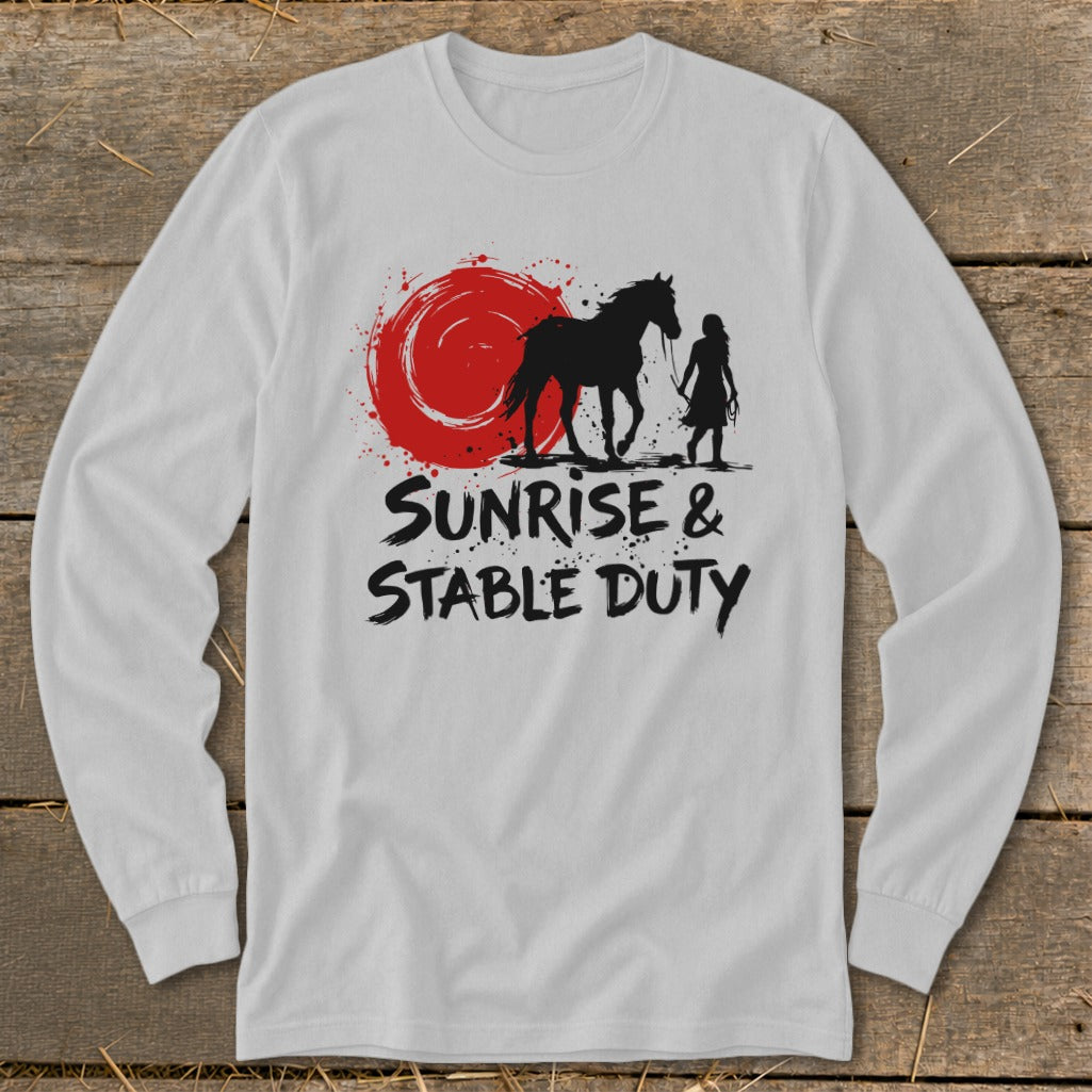 Black silhouette of a horse and person with text "Sunrise & Stable Duty" on a white shirt.