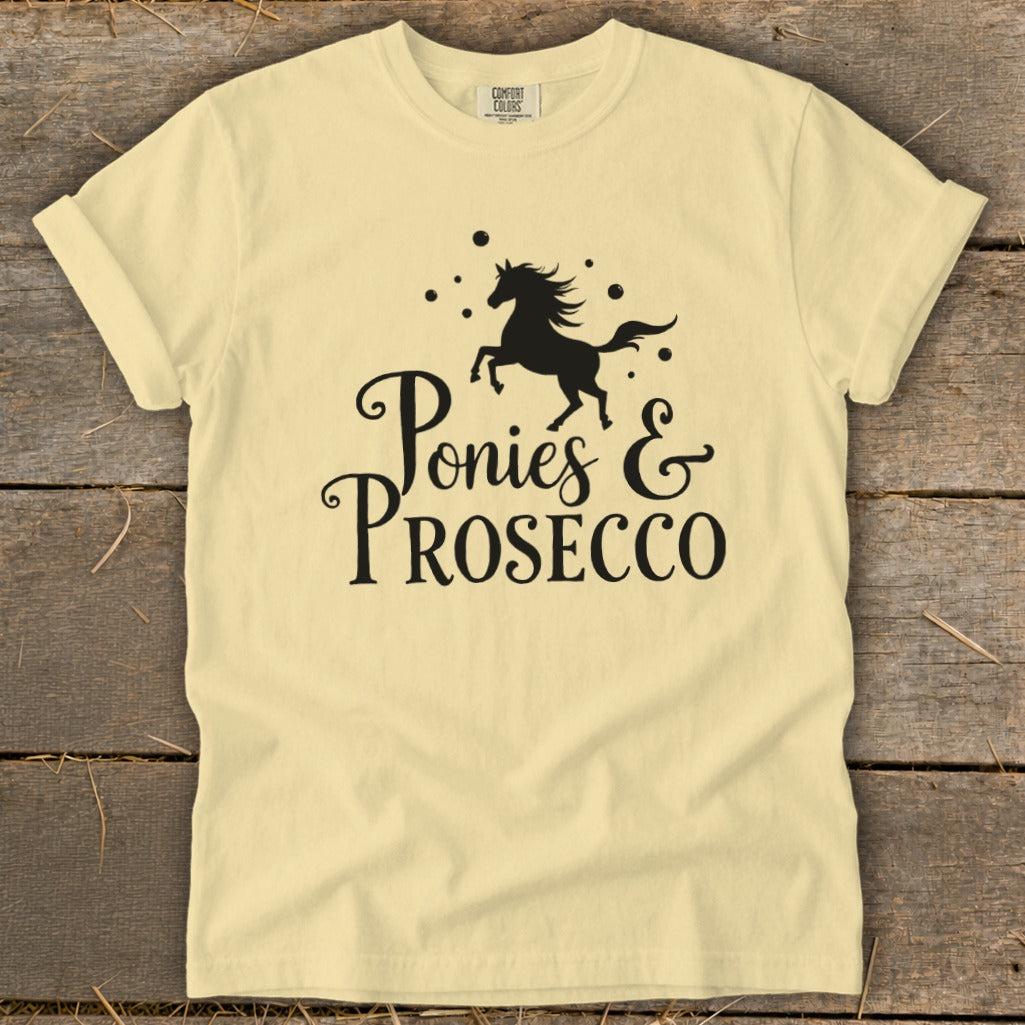 Yellow t-shirt with black text "Ponies & Prosecco" and a silhouette of a horse.
