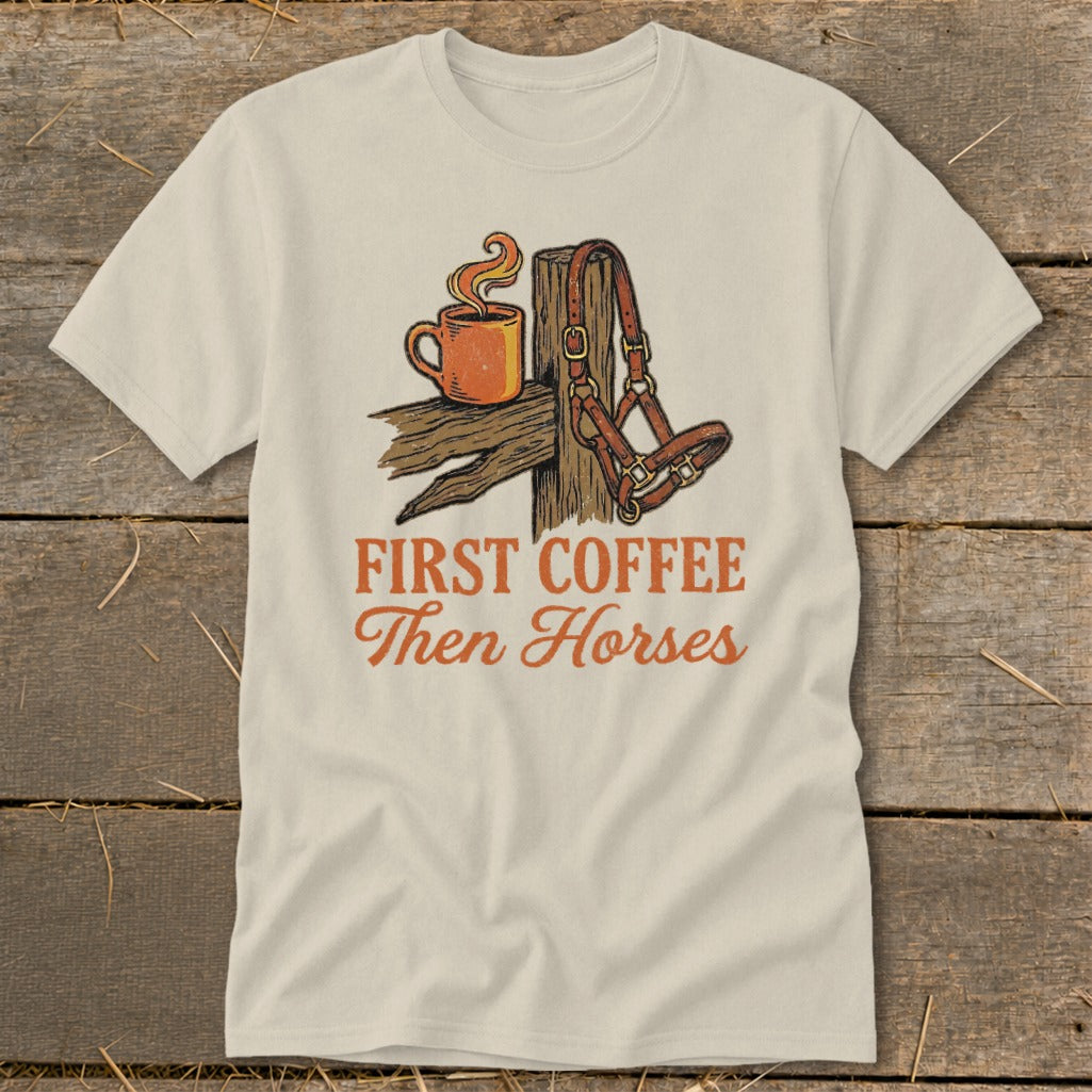 T-shirt with "First Coffee Then Horses" text and coffee cup and horse halter graphic.