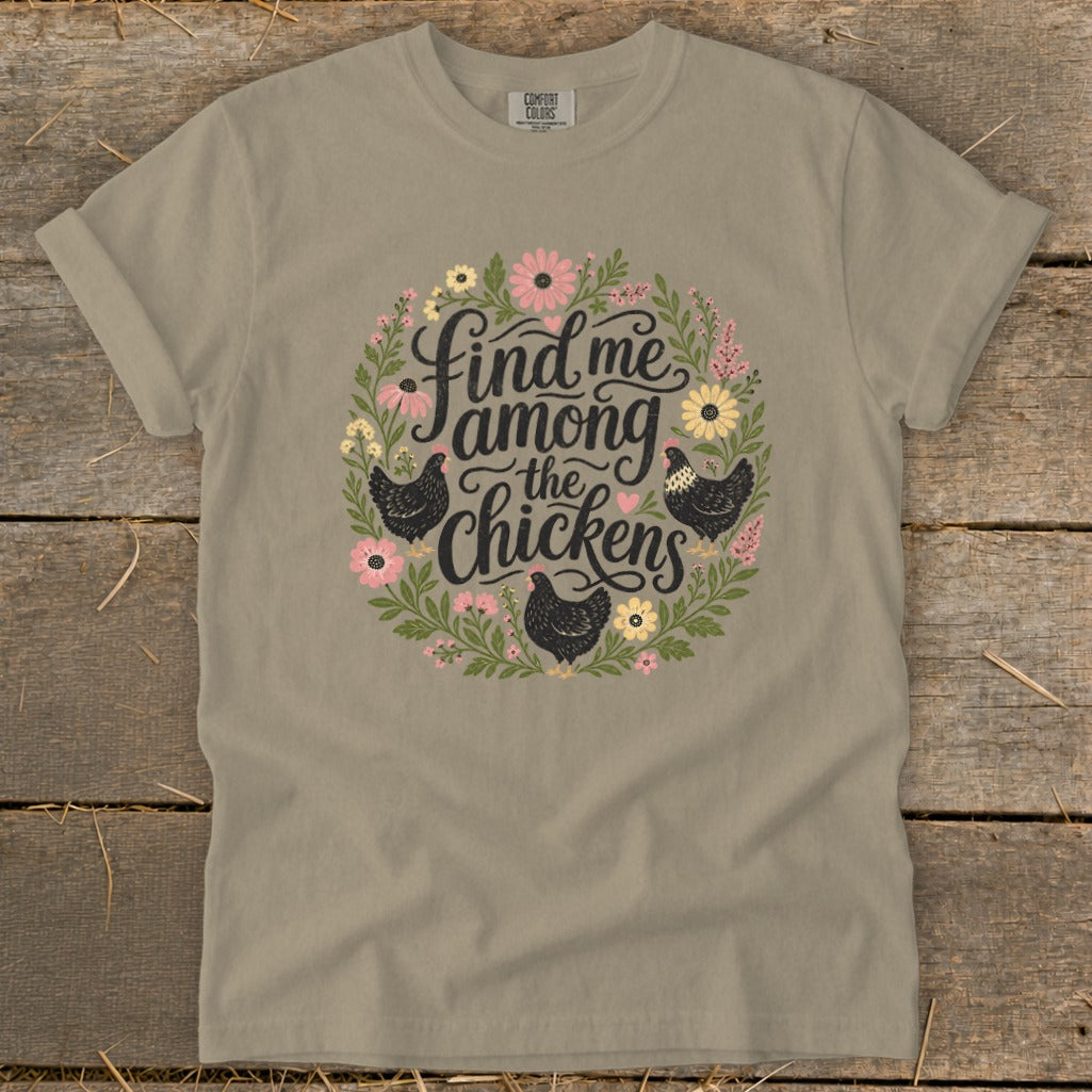 T-shirt with "Find me among the chickens" text and chicken illustration.
