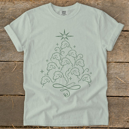 Light green t-shirt with a Christmas tree made of sheep and a star.