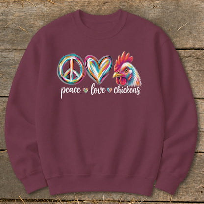 Maroon sweatshirt with peace, love, chicken symbols and text.