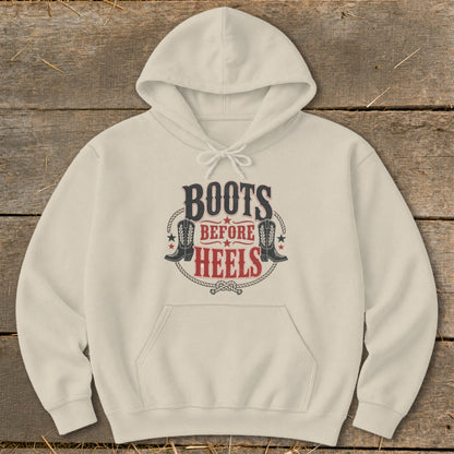 Cream hoodie with "Boots Before Heels" text and cowboy boot graphics.