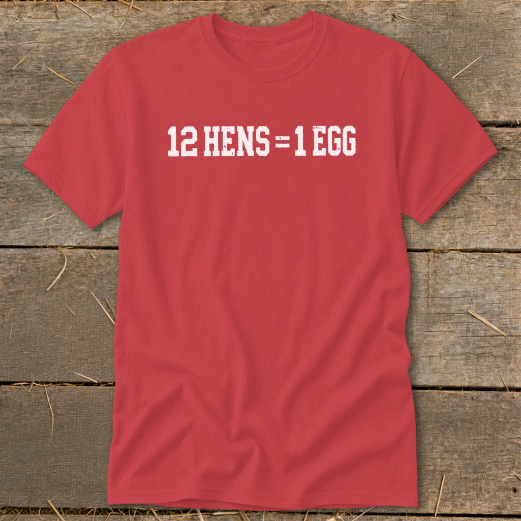 A red short-sleeved t-shirt with the white distressed text 12 HENS = 1 EGG displayed across the chest.