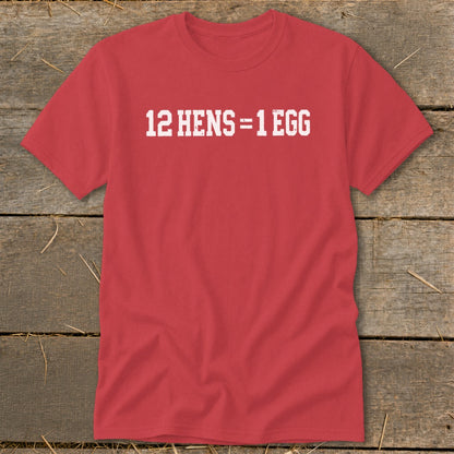 A red short-sleeved t-shirt with the white distressed text 12 HENS = 1 EGG displayed across the chest.