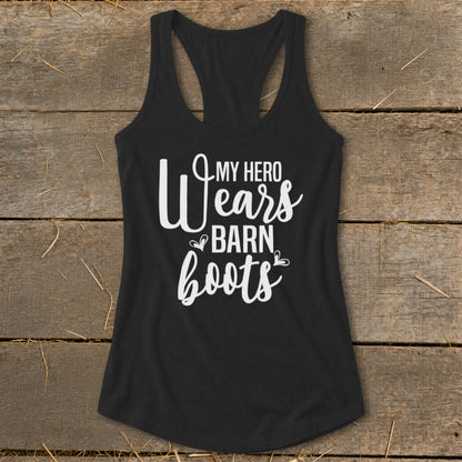 Black racerback tank top with white text reading "My Hero Wears Barn Boots".