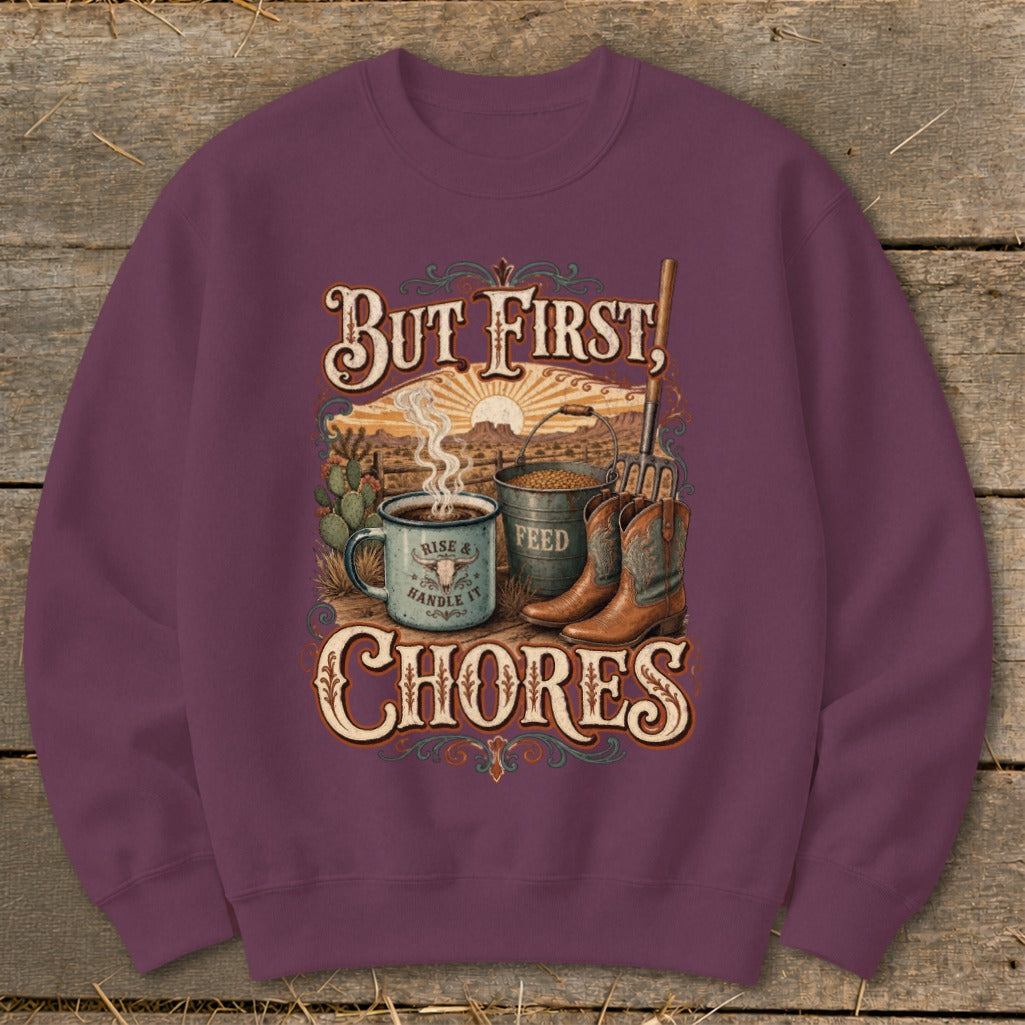 Crewneck sweatshirt with "But First, Chores" text, coffee mug, feed bucket, and cowboy boots graphic.