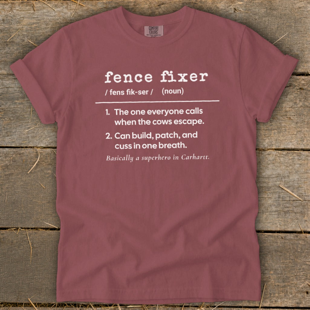 Maroon t-shirt with white text defining "fence fixer" as a superhero.