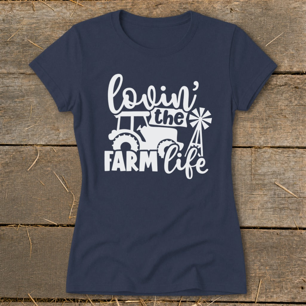 Navy t-shirt with white "lovin' the FARM life" graphic featuring a tractor and windmill.