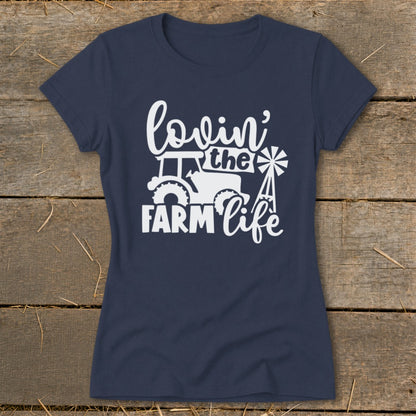 Navy t-shirt with white "lovin' the FARM life" graphic featuring a tractor and windmill.