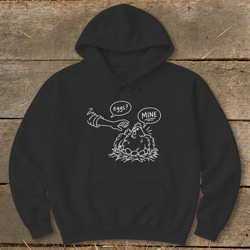 Black hoodie with a white line drawing of a chicken on a nest with eggs, saying "MINE."