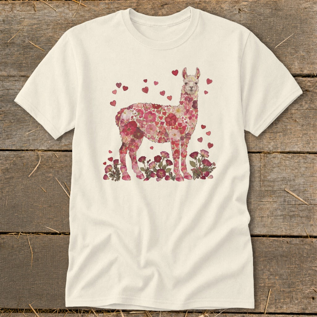 Cream t-shirt with a floral llama design and scattered red hearts.