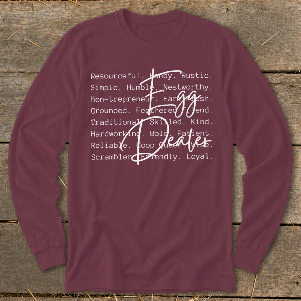 Maroon long-sleeve shirt with "Egg Dealer" and descriptive words.
