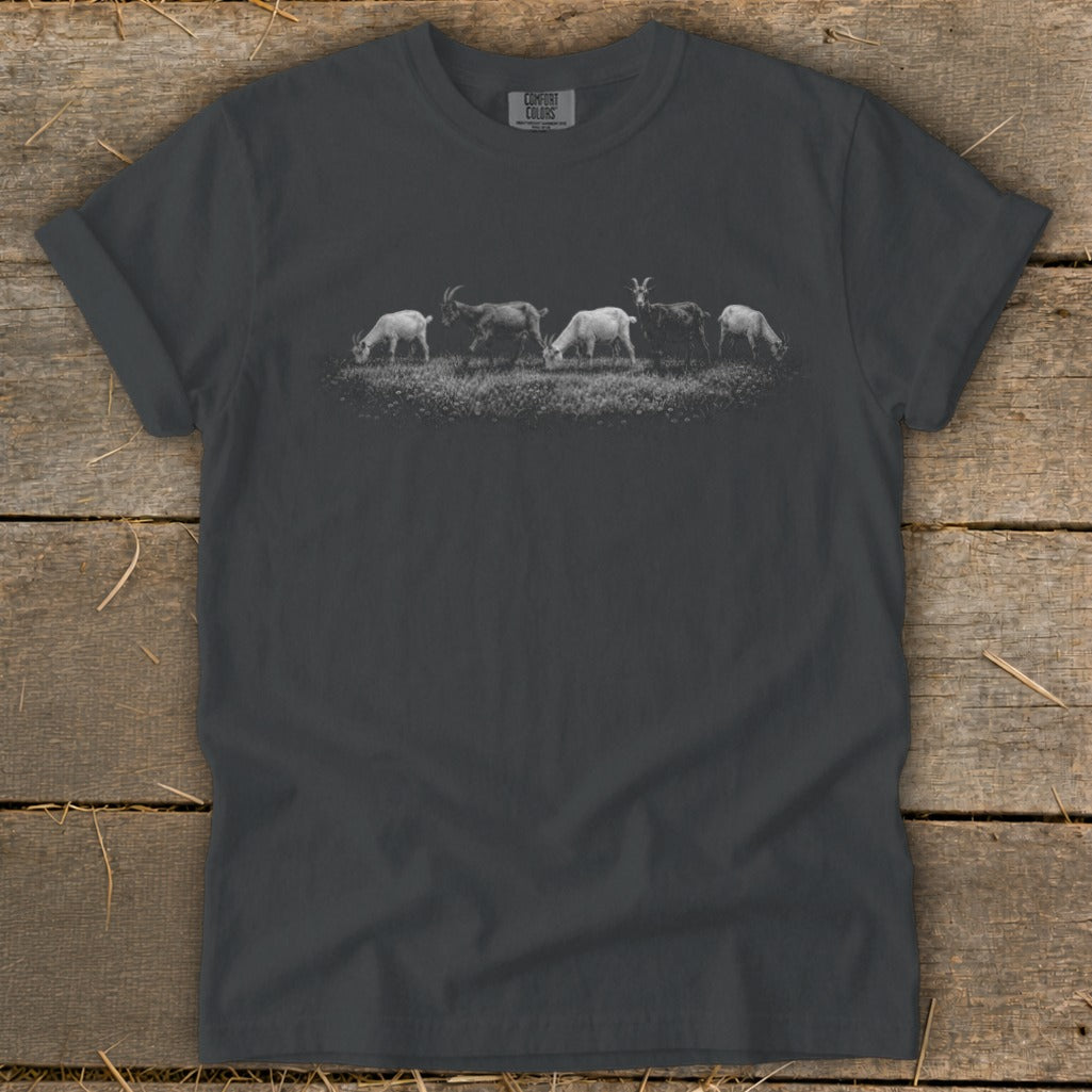 Charcoal t-shirt with five goats grazing in a field graphic.
