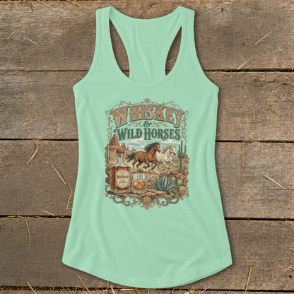 Tank top with "Whiskey & Wild Horses" text, horses, whiskey bottle, and desert landscape.