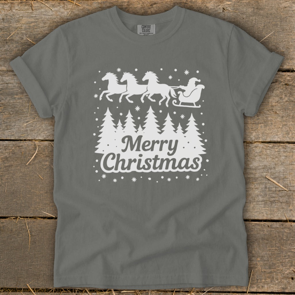 Grey t-shirt with white graphic of Santa's sleigh pulled by horses over trees, saying "Merry Christmas".