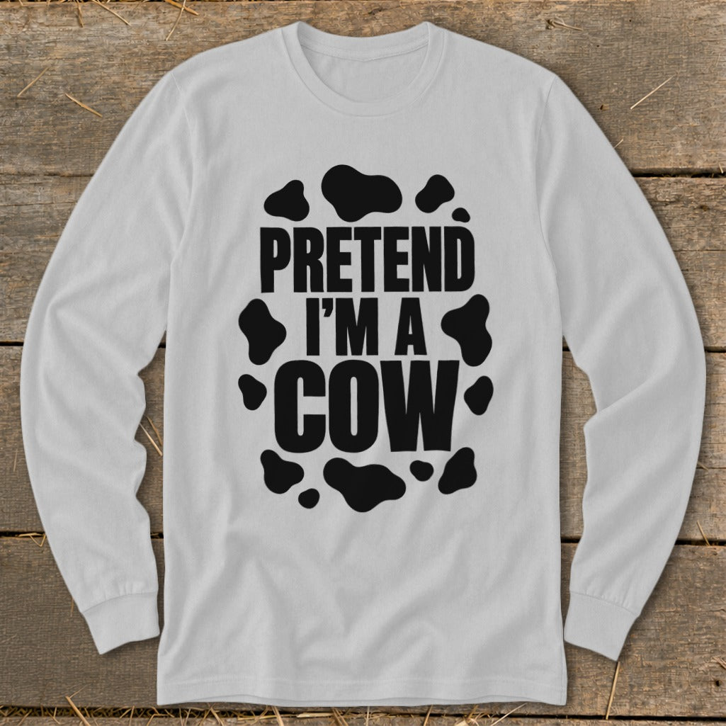 White long sleeve shirt with "PRETEND I'M A COW" text and black cow spots.