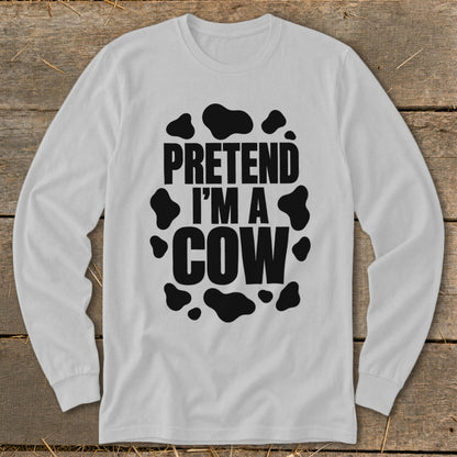 White long sleeve shirt with "PRETEND I'M A COW" text and black cow spots.