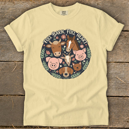 Yellow t-shirt with circular farm animal graphic and text "FULL BARN, FULL HEART".