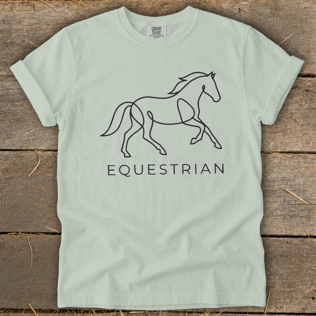 Light green t-shirt with a minimalist black line drawing of a running horse and text "EQUESTRIAN".