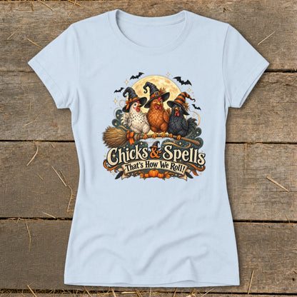 Three chickens in witch hats sit on a broomstick with text "Chicks & Spells That's How We Roll!".