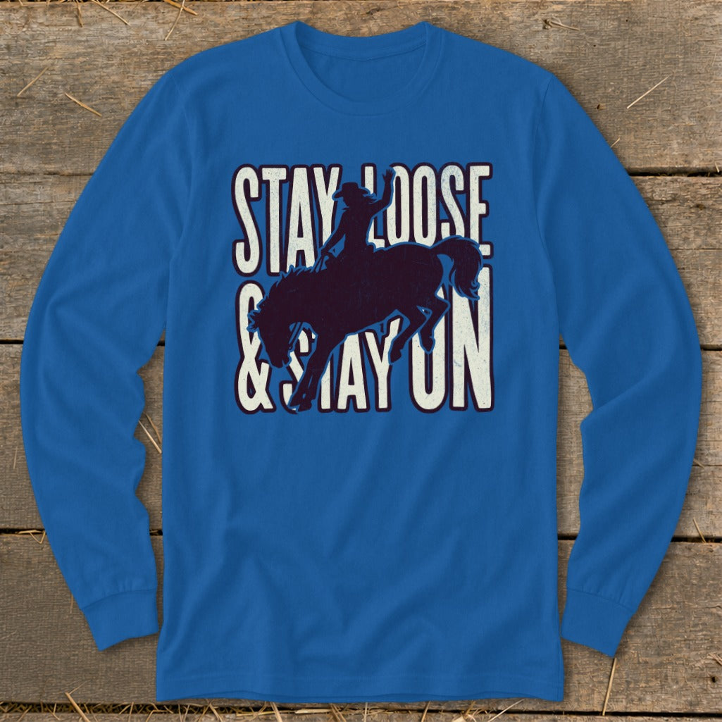 Royal blue long-sleeve shirt with "STAY LOOSE & STAY ON" text and bucking bronco graphic.