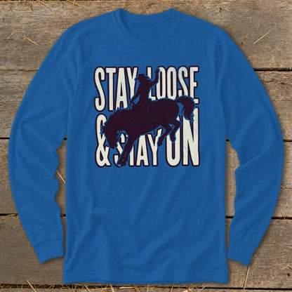 Royal blue long-sleeve shirt with "STAY LOOSE & STAY ON" text and bucking bronco graphic.