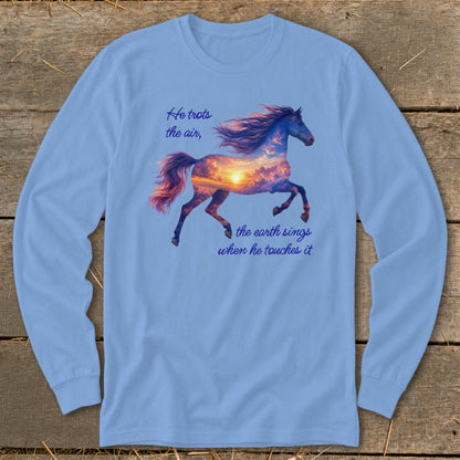 A light blue long-sleeve t-shirt features a running horse graphic filled with a sunset sky and text.