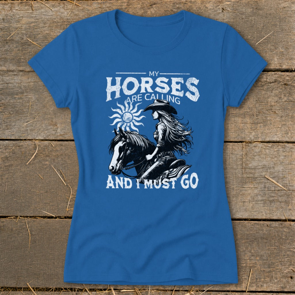 Blue t-shirt with graphic: "My Horses Are Calling And I Must Go."