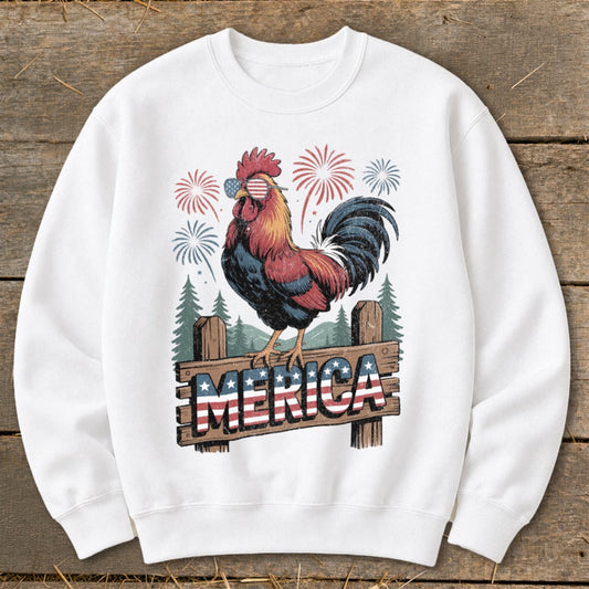 Rooster wearing American flag sunglasses, sitting on fence with "MERICA" text, fireworks.