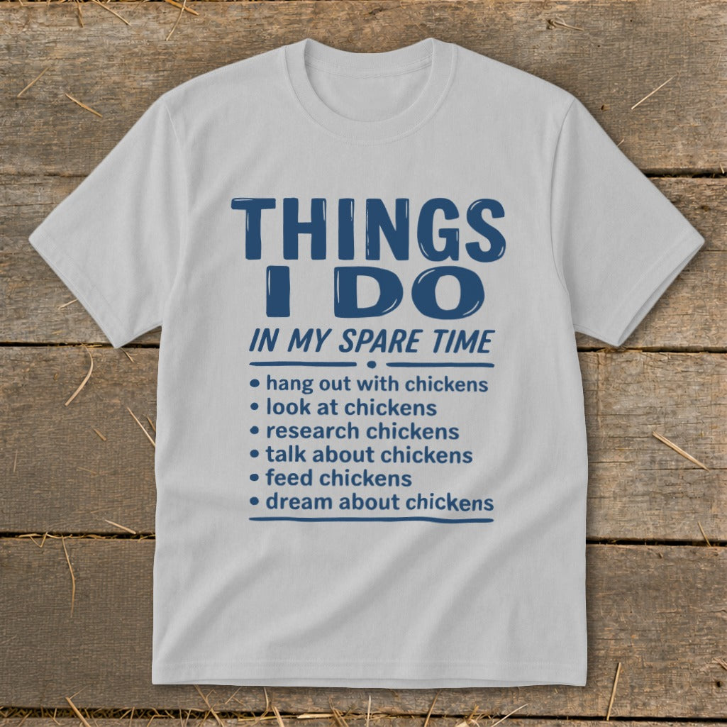 White t-shirt with blue text listing chicken-related spare time activities.