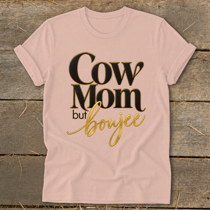 Pink t-shirt with "Cow Mom but boujee" graphic in black and gold text.