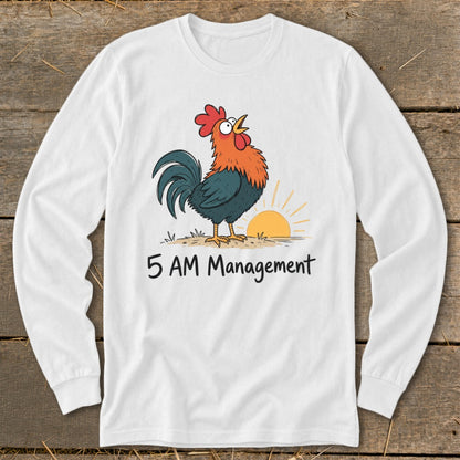 White long-sleeve shirt with cartoon rooster crowing at sunrise and "5 AM Management" text.