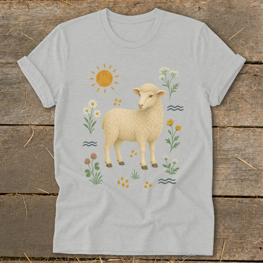 Light grey t-shirt with illustration of a lamb surrounded by flowers and a sun.