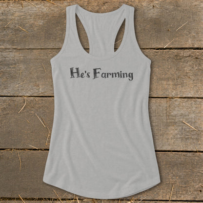 Gray racerback tank top with "He's Farming" text printed on the front.