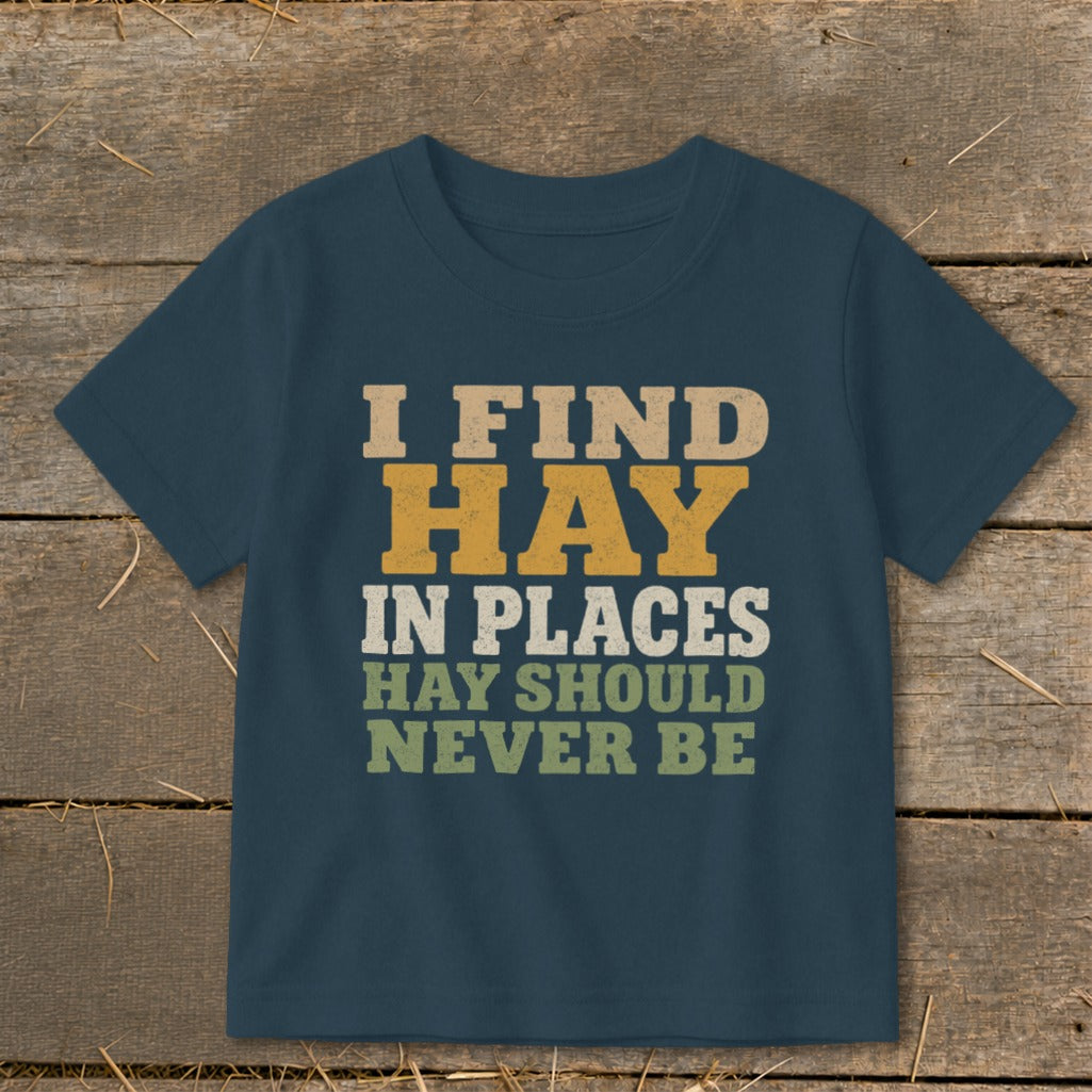 Navy t-shirt with text "I FIND HAY IN PLACES HAY SHOULD NEVER BE."