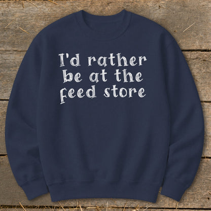 Navy sweatshirt with white text "I'd rather be at the feed store".