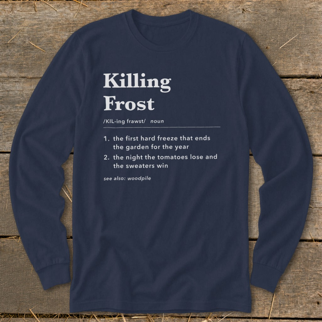 Dark blue long-sleeve t-shirt with white dictionary-style text defining Killing Frost, laid flat on wooden boards.
