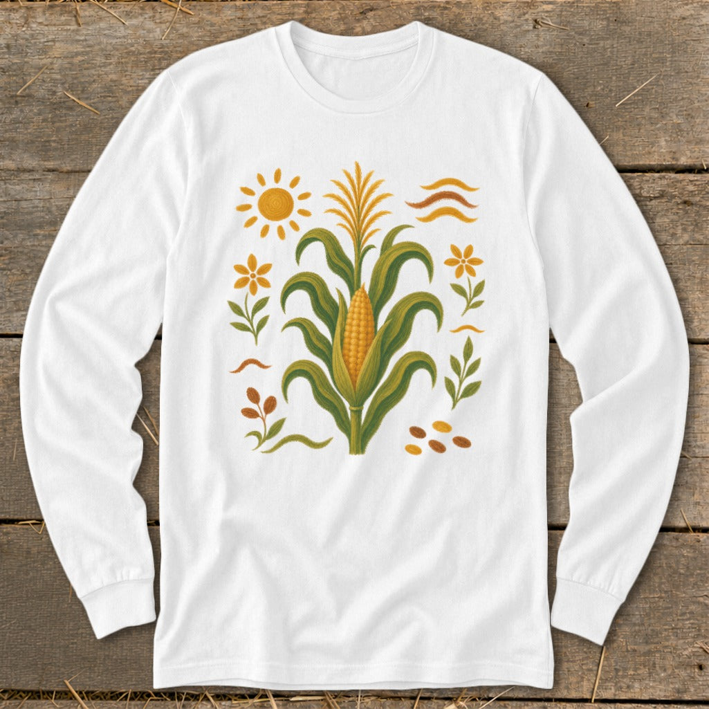 White long sleeve shirt with corn stalk, sun, and floral graphic.
