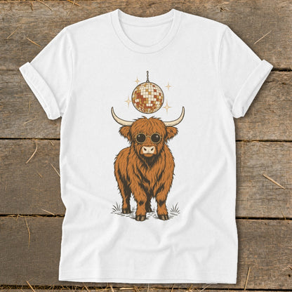 White t-shirt with a Highland cow wearing sunglasses and a disco ball above its head.