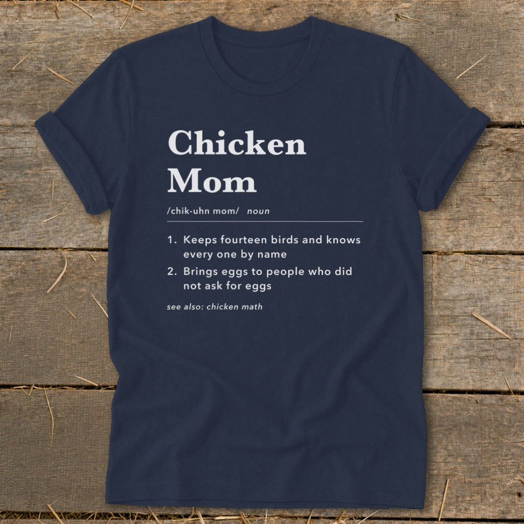 Navy t-shirt with "Chicken Mom" definition, listing two key traits and "see also: chicken math".