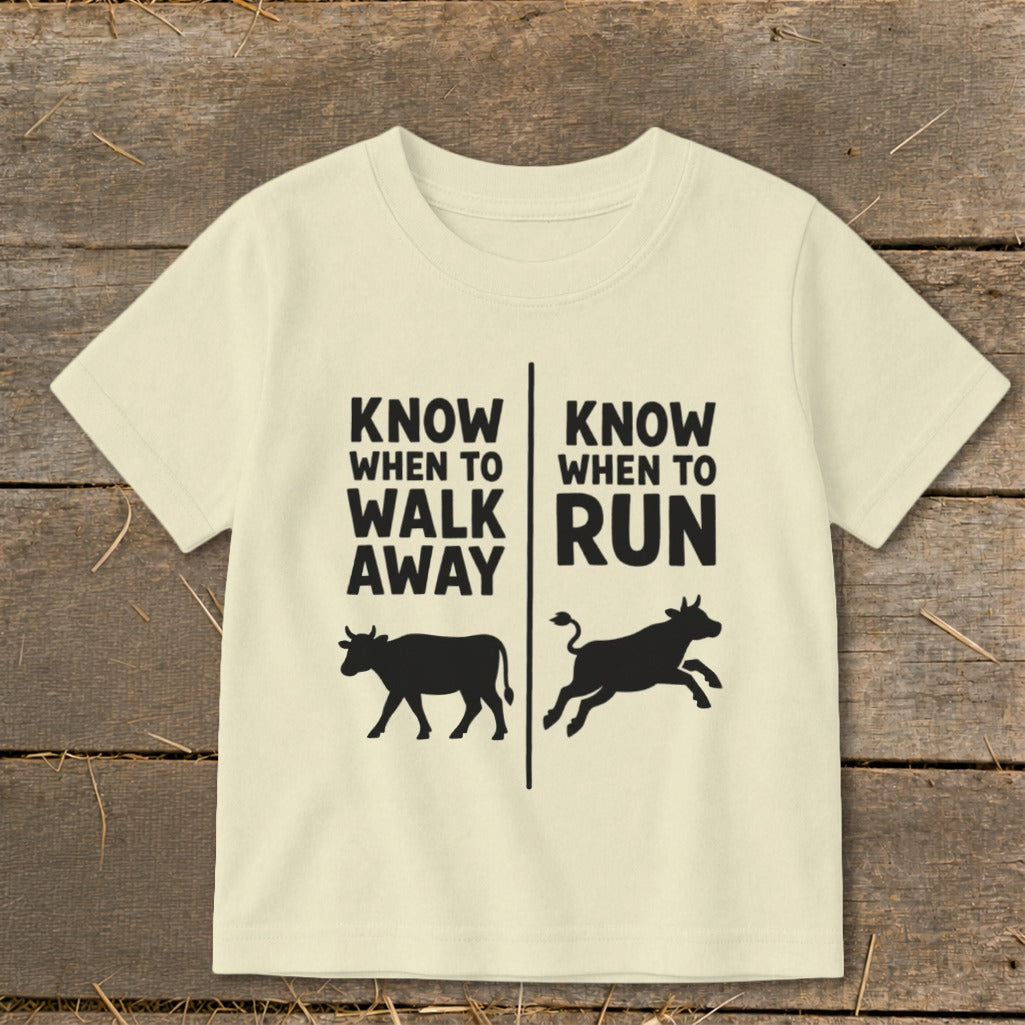 Cream t-shirt with "Know When To Walk Away" and "Know When To Run" text and cow graphics.